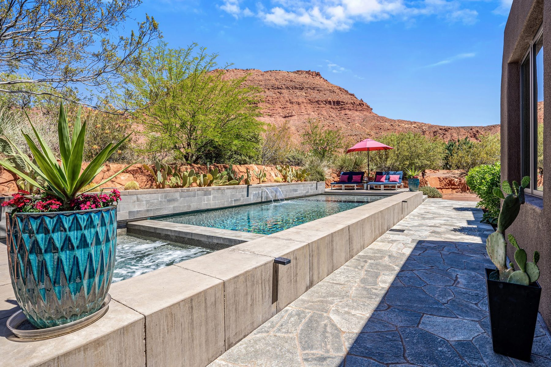 Poolside hardscaping and desert landscaping