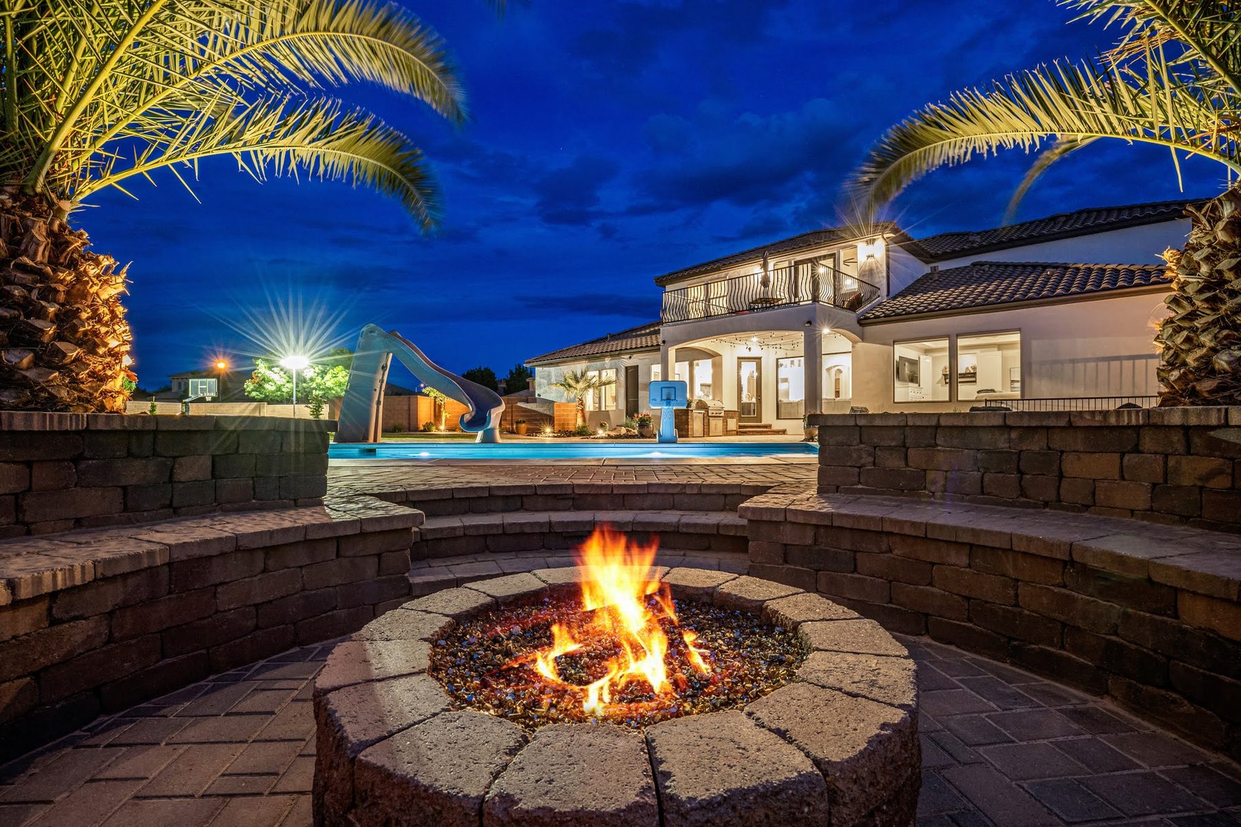 Outdoor living space with fire pit and pool