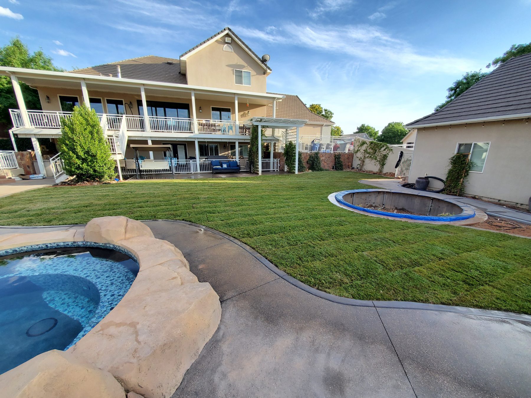 Completed backyard lawn after sod installation
